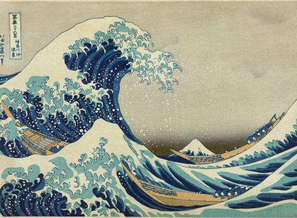 colored woodblock print of a giant wave crashing at sea with small boats beneath it