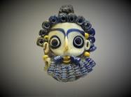 Glass pendant, 4th or 3rd century BC.