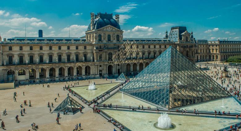 the louvre courtyard with pyramid and crowds